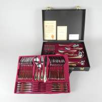 Argenterie : Ménagère 12 couverts NIVELLA Solingen en inox 2 tons argenté et doré avec couverts de service dans une mallette