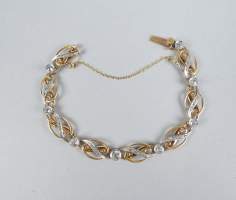 Bijou : Bracelet en or jaune 18K et platine serti de diamants dont un principal