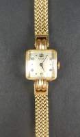 Bijou : Montre bracelet de dame BUREN Grand Prix en or jaune 18K (boîtier et bracelet) mouvement à remontoir (en état)