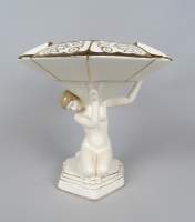 Céramique : Surtout en faïence crème Art Déco rehauts d'or - Dame portant une coupe - circa 1925