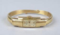 Bijou : montre bracelet de dame BAUME & MERCIER GENEVE en or 18K bracelet rigide mouvement à remontoir (fonctionne mais s'arrête)