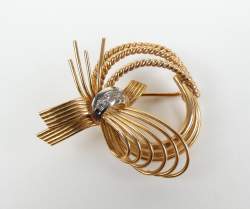 Bijou : Broche - Noeuds - en or jaune 18K sertie de 3 pierres incolores