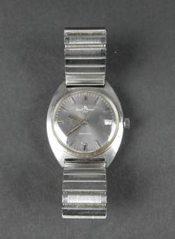 Bijou : Montre bracelet d'homme en acier BAUME & MERCIER Baumatic avec dateur mvt automatique (en état) (couronne remplacée , points d'oxydation) bracelet rapporté